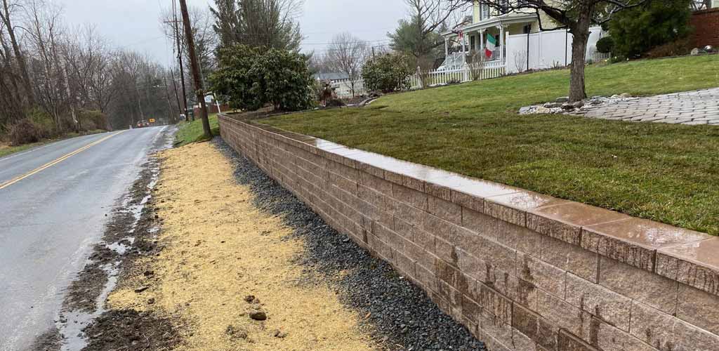 Precast concrete block retaining wall.