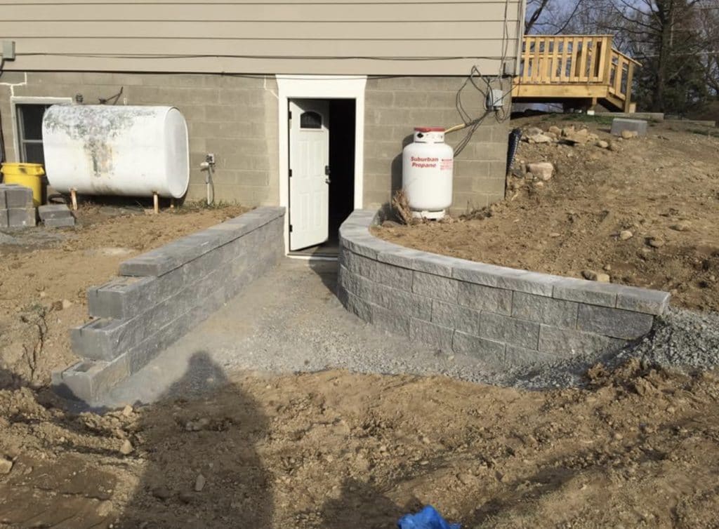 Basement egress/ walkout excavation. Partially installed basement walkout