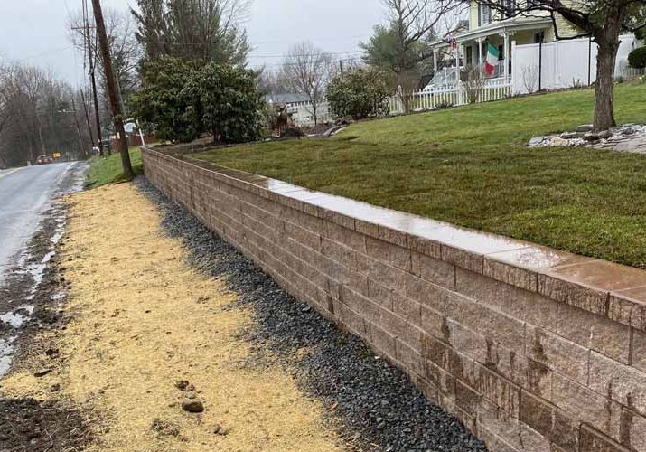 Precast concrete block retaining wall.