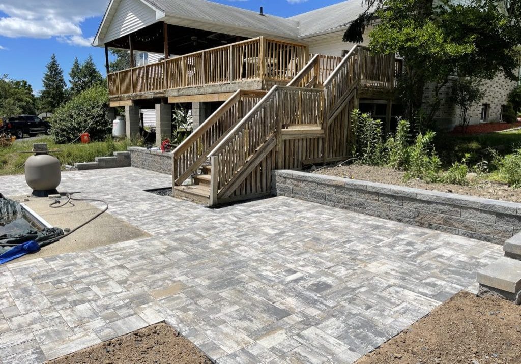 Concrete block retaining walls and patio.