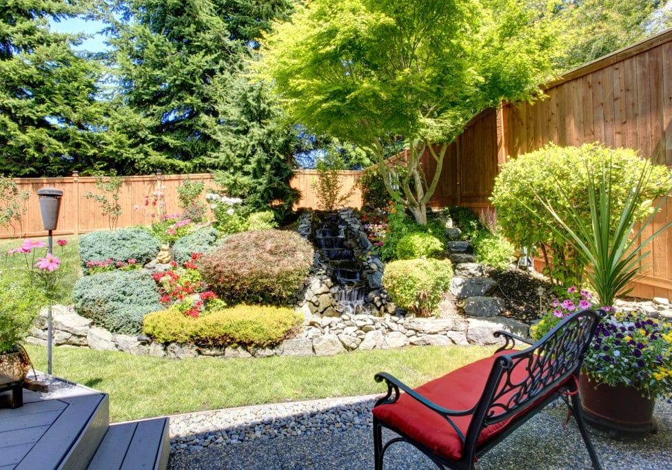 Sitting area with view of beautifully landscaped yard.