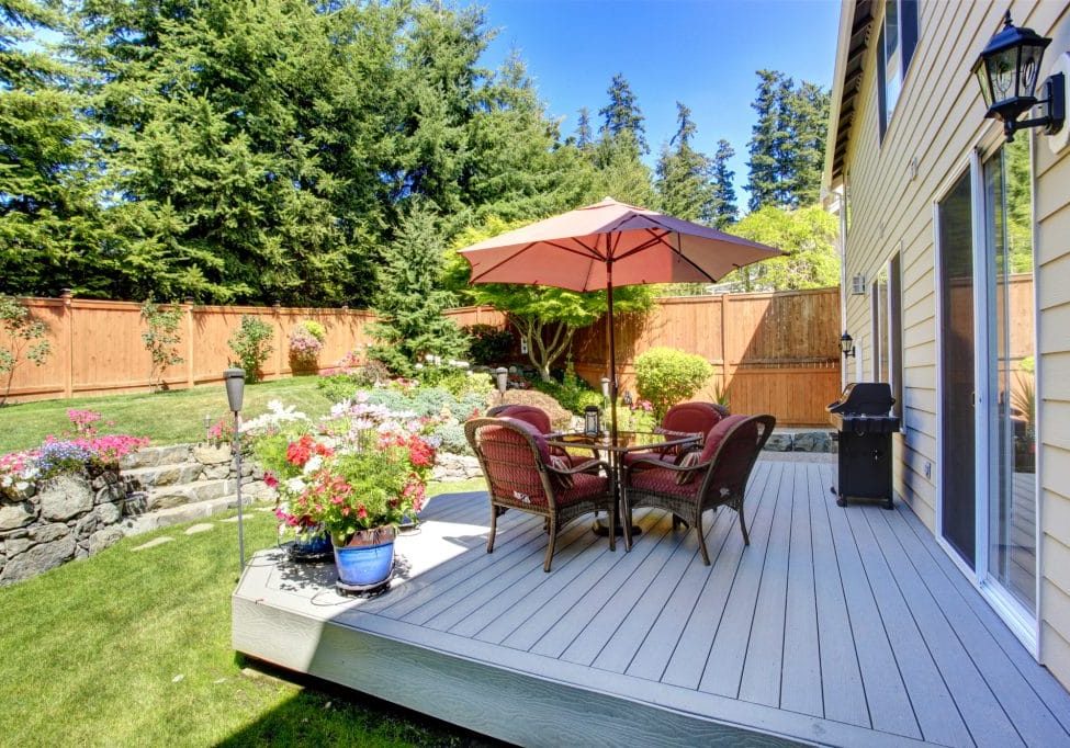 Backyard patio area with landscape